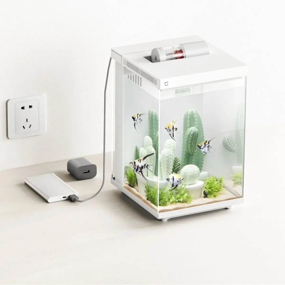 Xiaomi Mijia Smart Desktop Aquarium 10L with app-controlled feeding and filtration, featuring clear glass and aquatic plants.
